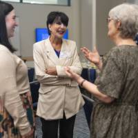 President Mantella and Susie Ziegler talking with avent attendee